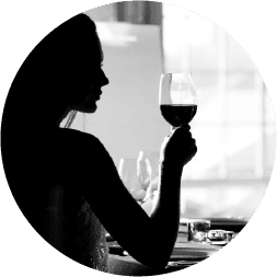 Woman enjoying wine in a Vancouver Waterfront tasting room